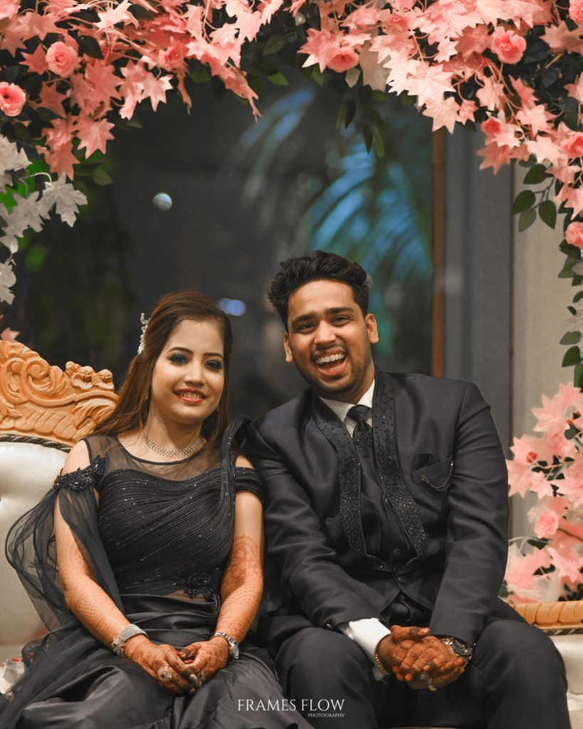 A beautiful Telugu wedding couple sitting behinds close together , captured in an intimate moment captures by Framesflow photography in Hyderabad / Build Your Quote