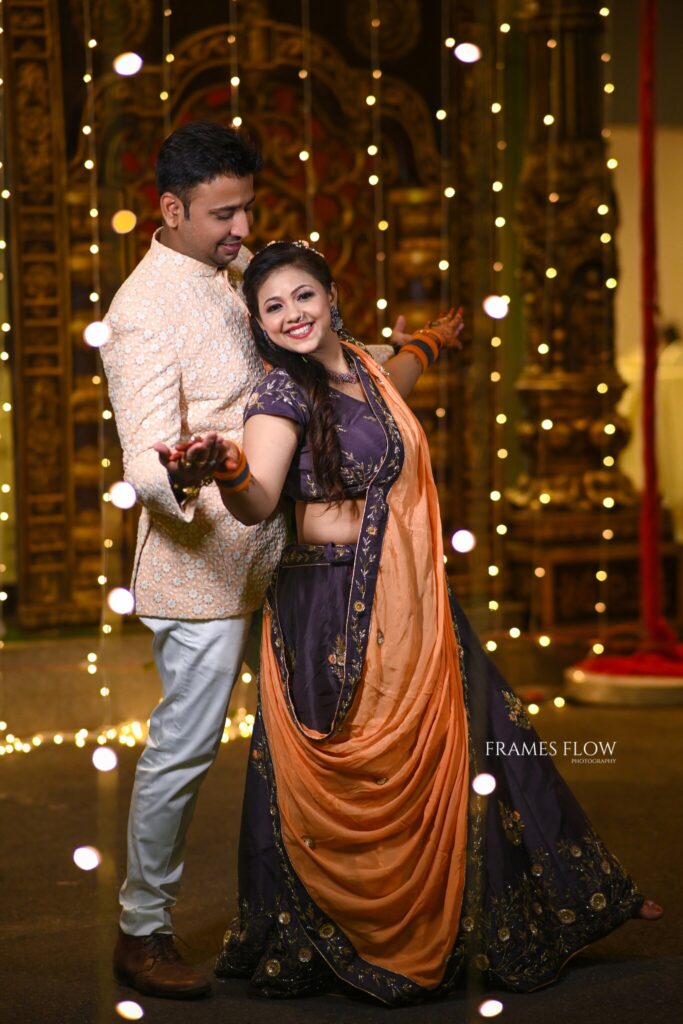 The Telugu Wedding couple stills like titanic pose during their traditional sangeet occasion captured by Framesflow photography in Hyderabad