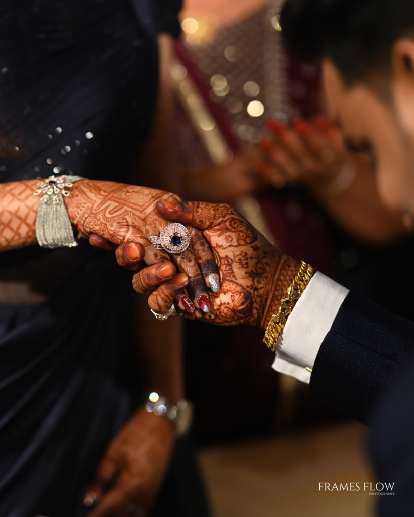 Frames flow photography captures the beautiful picture of the couple ,the Telugu groom holds the brides hand with some gratitude during their Reception in Hyderabad/ Build Your Quote