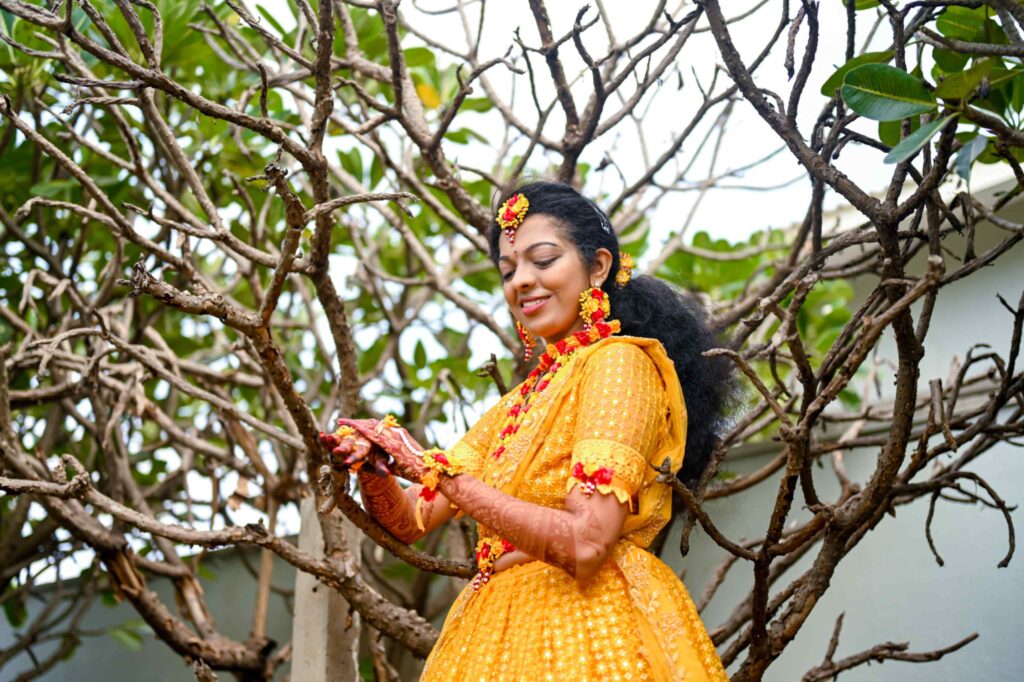 The Telugu bride ready to her haldi occasion with the shining look captured by Framesflow photography in Hyderabad