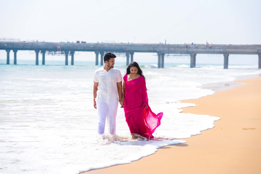 The Beautiful couple walking in the beach and enjoying their Pre wedding shoot captured by Framesflow photography in Hyderabad