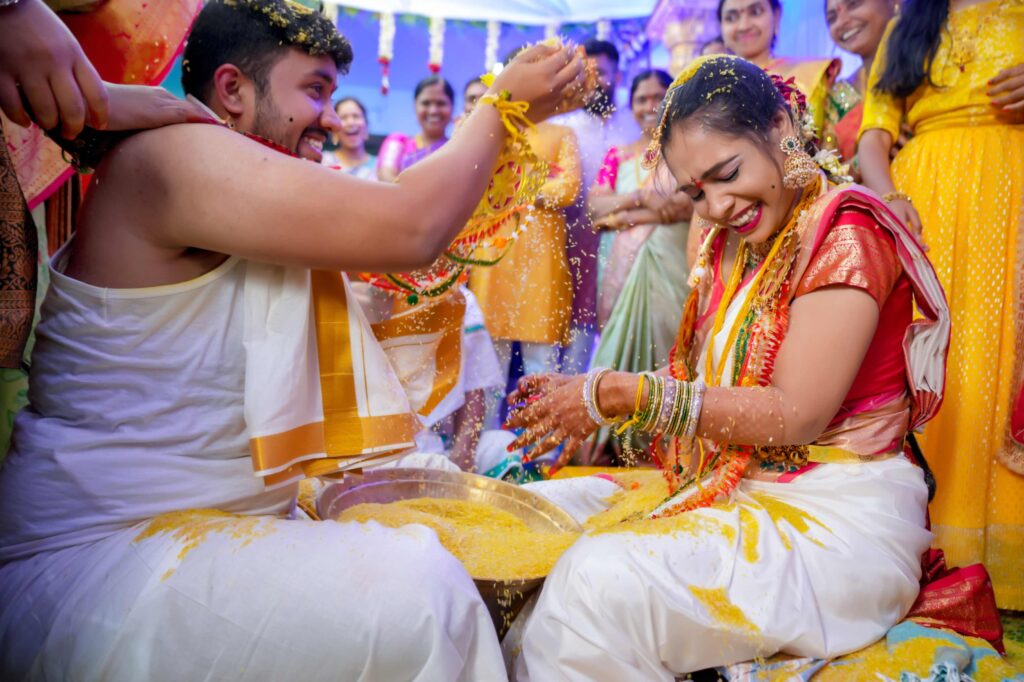 The Telugu wedding couple feels excited, they follows traditional rituals and enjoying a lots of happiness,captured by Framesflow photography in Hyderabad.