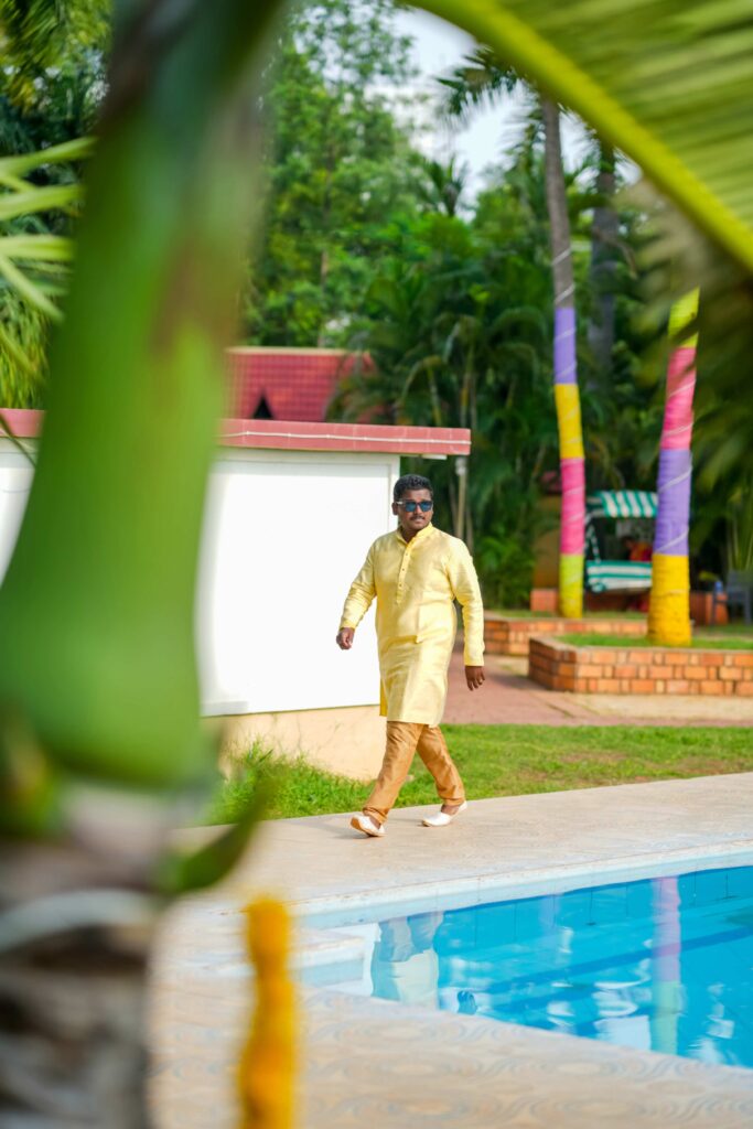 Telugu groom ready with his haldi outfit getting excited, during his wedding celebrations ,captured by Framesflow photography in Hyderabad