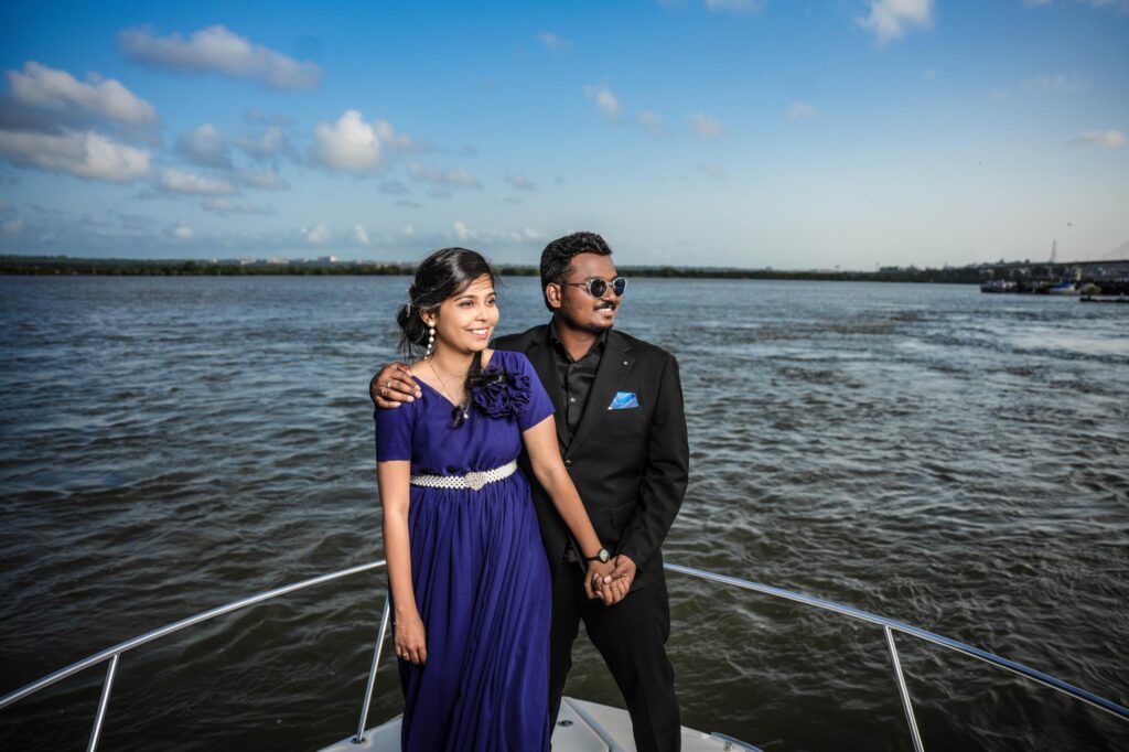 A beautiful Telugu couple poses on a yacht during their pre-wedding shoot, captured by Framesflow Photography in Hyderabad