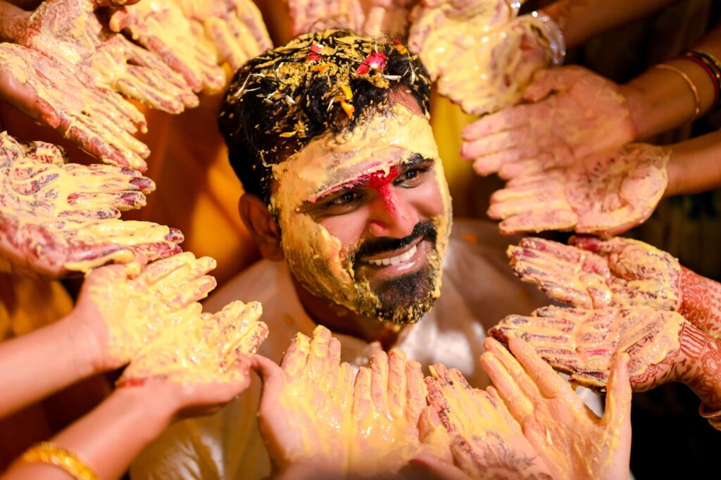 The Telugu Groom is celebrating haldi occassion with his relatives very happily captured by Framesflow photography in Hyderabad