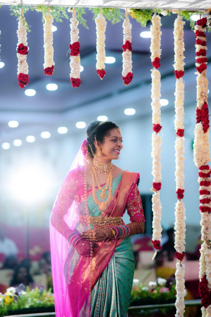 The Telugu bride was excited to enters mandapam captured by Framesflow photography in Hyderabad