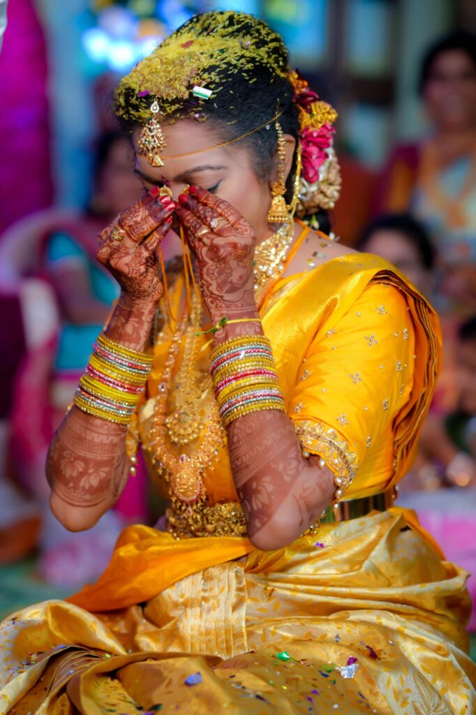 Telugu bride, teary-eyed with emotion, cherishes her mangalsutra and expresses heartfelt gratitude on her wedding day captured by Framesflow photography in Hyderabad